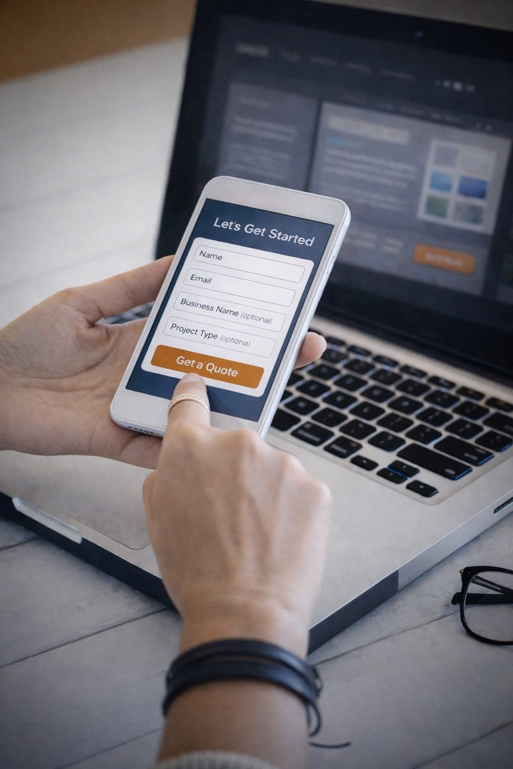 Professional reviewing landing page design on phone